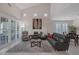 Comfortable living room with a vaulted ceiling, and a large window at 1912 Summer Pine Ct # 103, Las Vegas, NV 89134