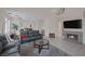 Expansive living room with a fireplace, plush seating, and open to dining at 1912 Summer Pine Ct # 103, Las Vegas, NV 89134