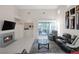 Spacious living area featuring a fireplace, stylish furnishings, and an open layout at 1912 Summer Pine Ct # 103, Las Vegas, NV 89134