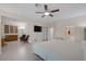 Spacious main bedroom suite with ceiling fan, recessed lights, TV, sitting area, and ensuite bathroom at 1912 Summer Pine Ct # 103, Las Vegas, NV 89134