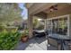 Enjoy outdoor living on this covered patio with a ceiling fan and views of the surrounding landscape at 1912 Summer Pine Ct # 103, Las Vegas, NV 89134