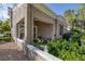 Charming covered patio with a table, chairs, and lush greenery, perfect for relaxation and entertaining at 1912 Summer Pine Ct # 103, Las Vegas, NV 89134
