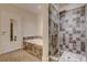 Bathroom with tiled shower, a separate jacuzzi tub, and modern fixtures for a spa-like experience at 200 Hoover Ave # 912, Las Vegas, NV 89101
