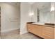 Modern bathroom features a sleek vanity, a large mirror, and contemporary lighting fixtures at 200 Hoover Ave # 912, Las Vegas, NV 89101