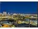 Vibrant Las Vegas skyline view with mountain backdrop from a high-rise balcony at dusk at 200 Hoover Ave # 912, Las Vegas, NV 89101