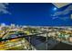 Balcony view of the city lights at night under a bright moon at 200 Hoover Ave # 912, Las Vegas, NV 89101