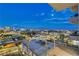 Scenic balcony view overlooking the bright Las Vegas skyline with mountains in the background at dusk at 200 Hoover Ave # 912, Las Vegas, NV 89101