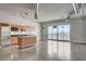 Bright, open kitchen and living area with stainless steel appliances and expansive windows at 200 Hoover Ave # 912, Las Vegas, NV 89101