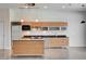Contemporary kitchen featuring stainless steel appliances, an island, and modern cabinetry at 200 Hoover Ave # 912, Las Vegas, NV 89101