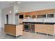 Well-lit kitchen showcasing stainless steel appliances, granite countertops, a center island and modern cabinets at 200 Hoover Ave # 912, Las Vegas, NV 89101