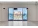 Bright living area with sliding glass doors showcasing city views and pendant lighting at 200 Hoover Ave # 912, Las Vegas, NV 89101