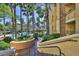 A luxurious community pool with lounge chairs and beautiful palm trees perfect for tenants and guests at 210 E Flamingo Rd # 419, Las Vegas, NV 89169