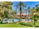 Luxurious pool with lounge chairs perfect for tenants and guests on a hot summer day surrounded by palm trees at 210 E Flamingo Rd # 419, Las Vegas, NV 89169