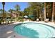 Inviting hot tub area with nearby seating and landscaping at 210 E Flamingo Rd # 419, Las Vegas, NV 89169