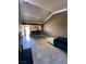 Open living area with tile floors, bar seating, and neutral walls at 210 E Flamingo Rd # 419, Las Vegas, NV 89169