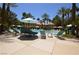 Relaxing pool area with lounge chairs and striped umbrellas at 210 E Flamingo Rd # 419, Las Vegas, NV 89169