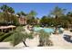 Expansive pool surrounded by palm trees and lounge chairs at 210 E Flamingo Rd # 419, Las Vegas, NV 89169