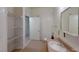 Bright bathroom with a vanity, a mirror, and storage shelves at 2141 Hussium Hills St # 102, Las Vegas, NV 89108
