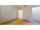 An open bedroom featuring neutral walls and carpet, complemented by bright natural light at 2141 Hussium Hills St # 102, Las Vegas, NV 89108