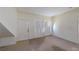 A bright living room featuring neutral paint, plush carpet, and a large sun-filled window at 2141 Hussium Hills St # 102, Las Vegas, NV 89108