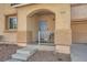 Close-up of front porch with archway and well-maintained desert landscaping at 2714 Cottonwillow St, Las Vegas, NV 89135