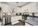 Well-lit kitchen featuring white cabinetry and stainless steel appliances at 2714 Cottonwillow St, Las Vegas, NV 89135