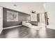 Open-concept living room with modern floors and large windows at 2714 Cottonwillow St, Las Vegas, NV 89135