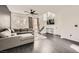 Bright living room featuring dark floors and view to staircase at 2714 Cottonwillow St, Las Vegas, NV 89135