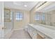 Elegant bathroom featuring dual sinks, a glass-enclosed shower, and a large mirror at 2851 S Valley View Blvd # 1026, Las Vegas, NV 89102