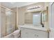 Bathroom featuring shower with gold trim, vanity with granite countertop and modern lighting at 2851 S Valley View Blvd # 1026, Las Vegas, NV 89102