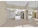 Open-concept kitchen featuring modern appliances and a breakfast bar, flowing into a large living area at 2851 S Valley View Blvd # 1026, Las Vegas, NV 89102