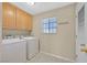 Laundry room featuring a washing machine and dryer, cabinets and a window for natural light at 2851 S Valley View Blvd # 1026, Las Vegas, NV 89102