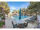 Community pool with several lounge chairs and a covered seating area at 2851 S Valley View Blvd # 1026, Las Vegas, NV 89102