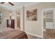 Bedroom with ensuite bathroom and walk-in closet featuring hardwood floors at 31 Via Mantova # 1, Henderson, NV 89011