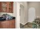 An entryway with decorative plant and granite countertop console table at 31 Via Mantova # 1, Henderson, NV 89011