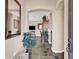 Inviting home foyer featuring tile floors and views into the living room at 31 Via Mantova # 1, Henderson, NV 89011