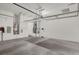 Spacious garage featuring overhead storage and ample room for vehicles and projects at 31 Via Mantova # 1, Henderson, NV 89011