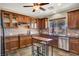 Well-equipped kitchen boasts stainless steel appliances, stone countertops, and custom cabinets at 31 Via Mantova # 1, Henderson, NV 89011