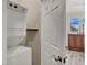 Efficient laundry area featuring a stacked washer and dryer near a bedroom at 31 Via Mantova # 1, Henderson, NV 89011