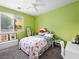 Cozy bedroom with a window, ceiling fan, and charming decor at 334 Shimmering Moon St, Henderson, NV 89015
