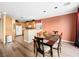 Dining area between the kitchen and living room with seating for six people at 334 Shimmering Moon St, Henderson, NV 89015