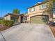 Charming two-story home with a three-car garage and stone accents at 334 Shimmering Moon St, Henderson, NV 89015