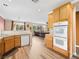 Spacious kitchen with a view of the living room and stainless steel appliances at 334 Shimmering Moon St, Henderson, NV 89015