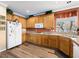 Well-lit kitchen featuring warm wooden cabinets and modern appliances at 334 Shimmering Moon St, Henderson, NV 89015