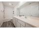 Bathroom featuring double sinks, modern fixtures, and a shower-tub combination at 376 Yellow Finch Ln, Henderson, NV 89012