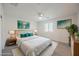 Cozy bedroom with soft carpet, white walls, and an abundance of natural light at 376 Yellow Finch Ln, Henderson, NV 89012