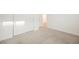 Bright bedroom featuring a large closet with white bi-fold doors at 376 Yellow Finch Ln, Henderson, NV 89012