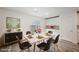 Bright dining area features modern table setting, sliding glass doors, and stylish decor at 376 Yellow Finch Ln, Henderson, NV 89012