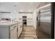 Bright kitchen featuring stainless steel appliances, quartz countertops, and a kitchen island at 376 Yellow Finch Ln, Henderson, NV 89012