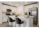 Modern kitchen features white cabinetry, stainless steel appliances, and a functional island at 376 Yellow Finch Ln, Henderson, NV 89012